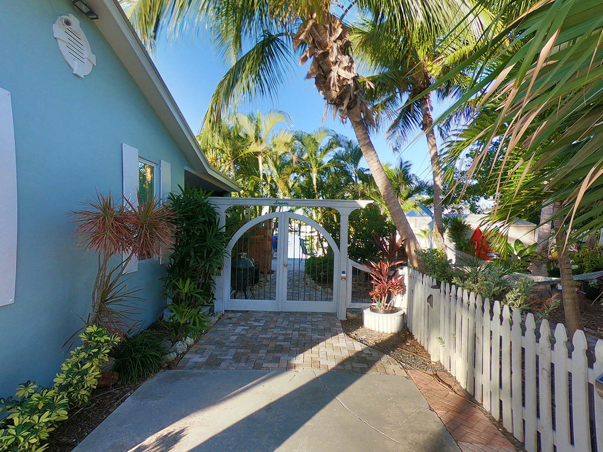 Gates lead to the water and our private fenced Palm Garden